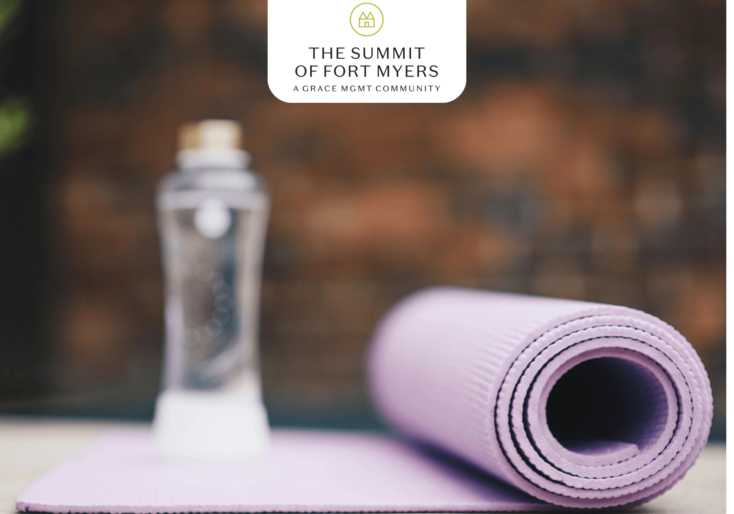 Summit of Fort Myers - Celebrating Yoga - The Summit of Fort Myers Yoga mat with water bottle in background